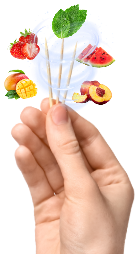 A hand holding PurePix flavored toothpicks with real fruit flavors